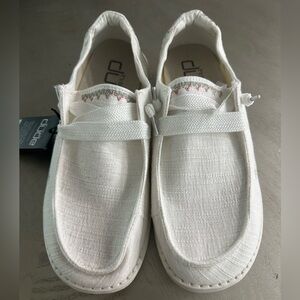 white hey dudes with pink and blue pattern on back